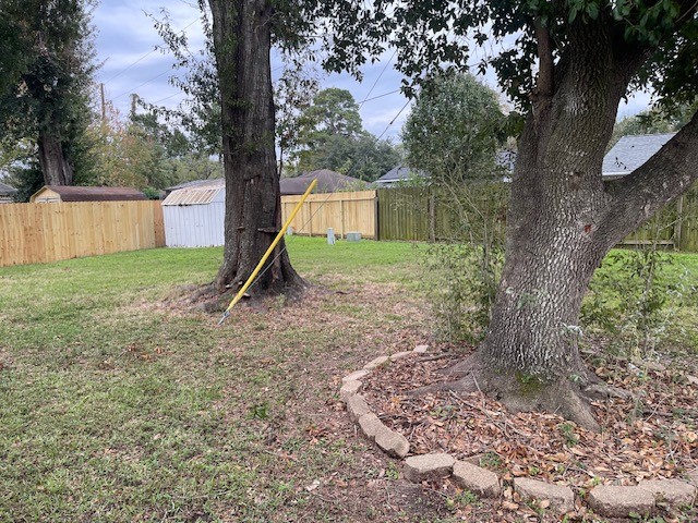 8226 Forest Point Drive Humble, TX 77338 - Photo 12 of 12 a view of a backyard with a tree