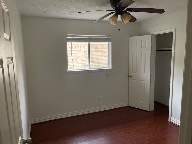 8226 Forest Point Drive Humble, TX 77338 - Photo 8 of 12 a view of an empty room with a window and wooden floor