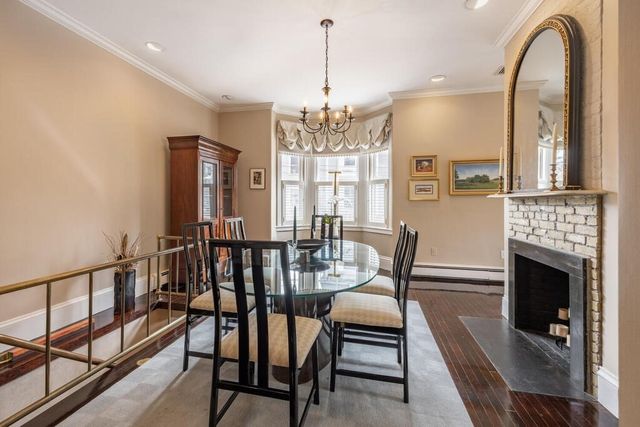 a view of a livingroom with furniture window and wooden floor