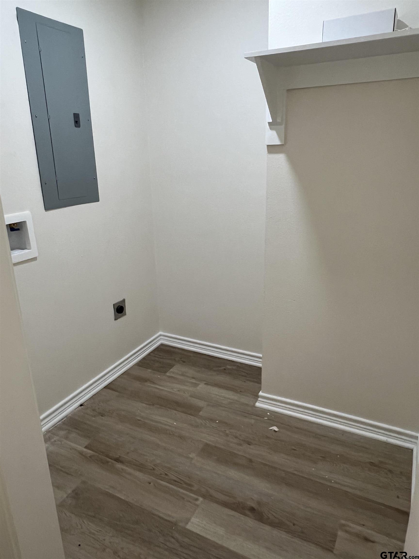 125 Pecan Drive Bullard, TX 75757 - Photo 16 of 16 a view of a small space with wooden floor and a window