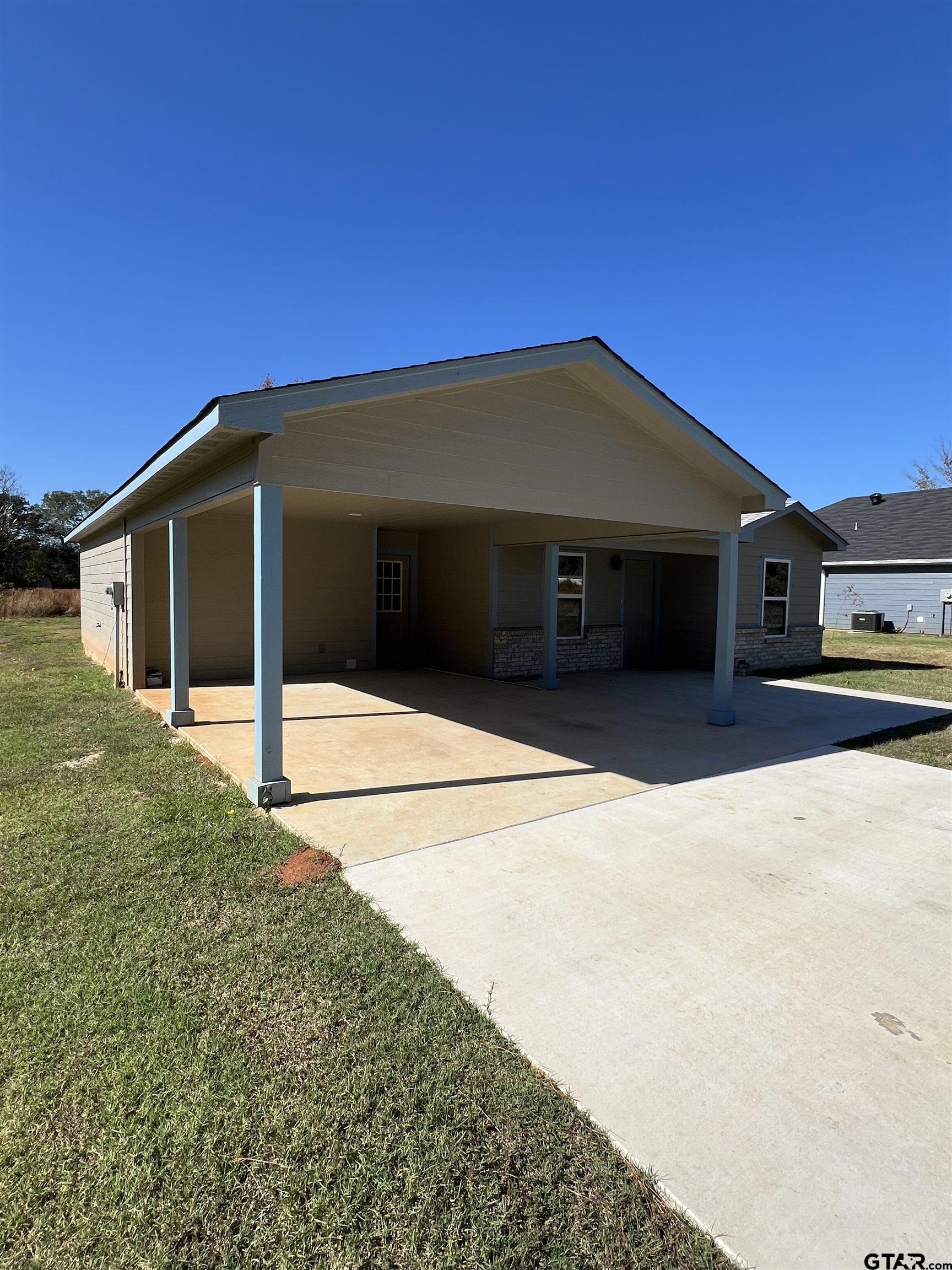 125 Pecan Drive Bullard, TX 75757 - Photo 2 of 16 a front view of a house with a garage