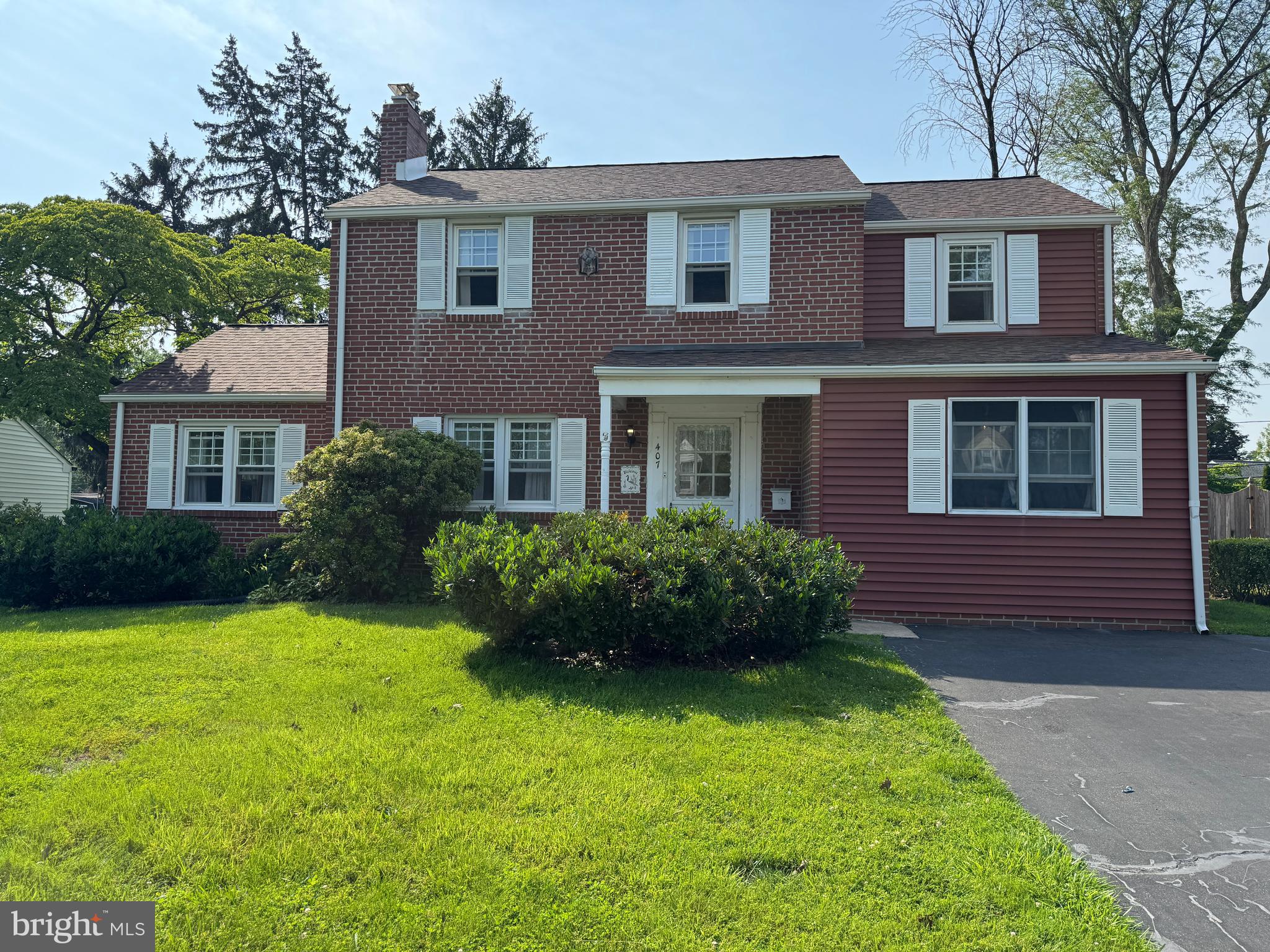 407 Willow Road Oreland, PA 19075 - Photo 1 of 30 a view of a house with garden and yard