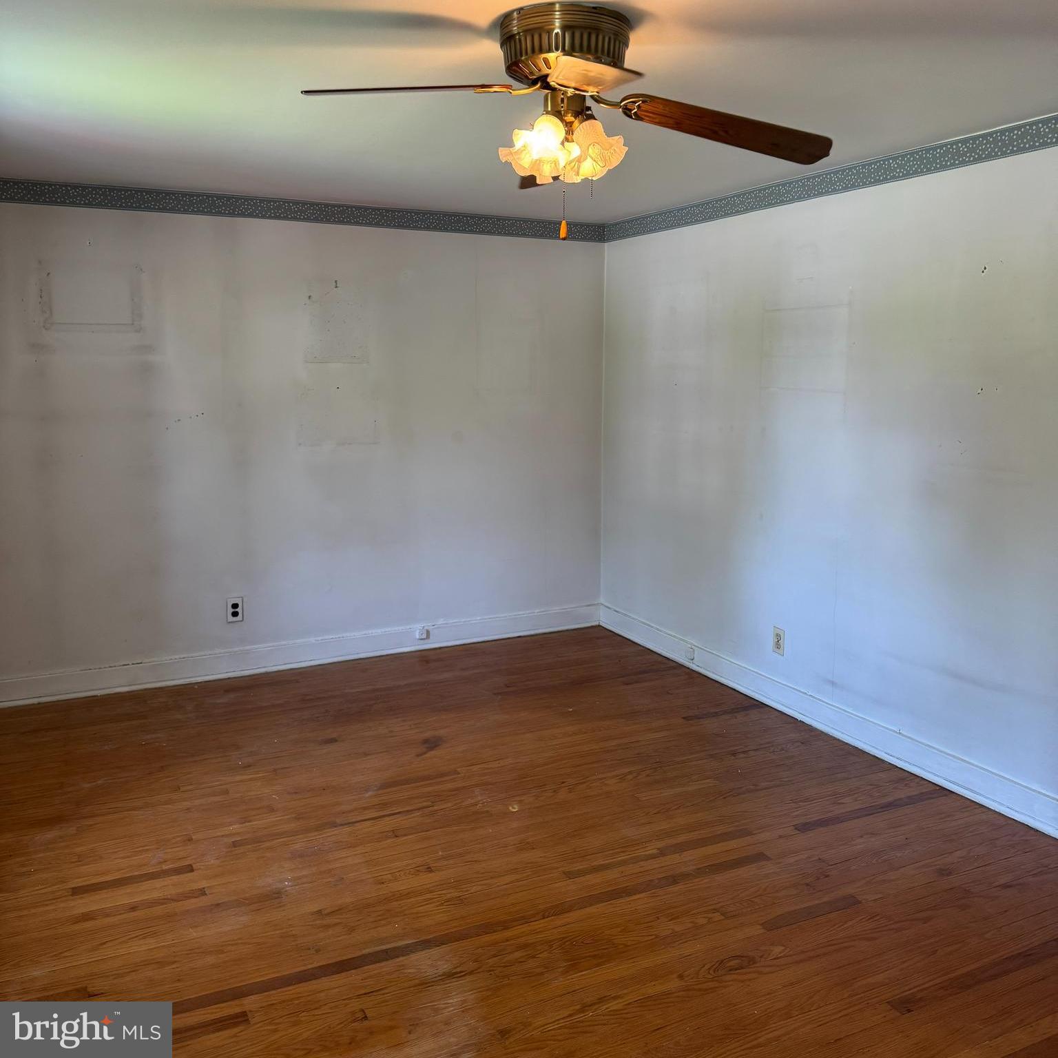 407 Willow Road Oreland, PA 19075 - Photo 15 of 30 a view of an empty room with wooden floor