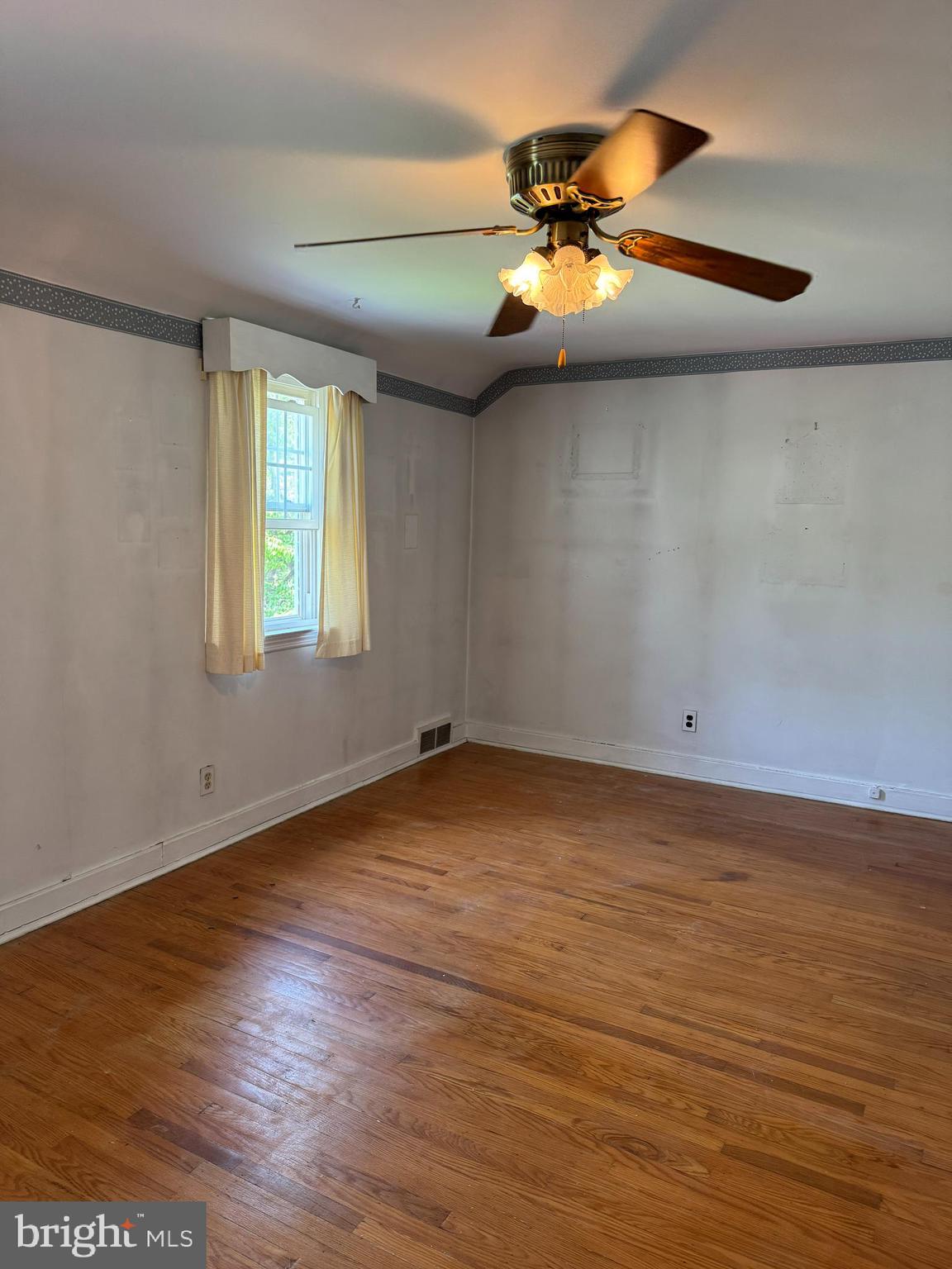 407 Willow Road Oreland, PA 19075 - Photo 19 of 30 wooden floor in an empty room with a window