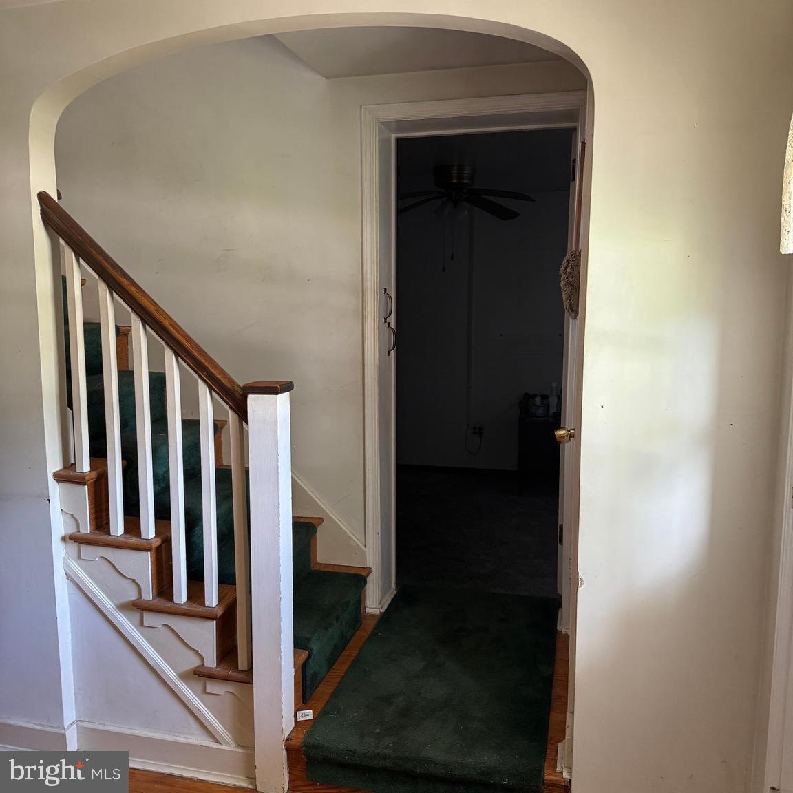 407 Willow Road Oreland, PA 19075 - Photo 6 of 30 a view of a hallway with wooden floor and staircase