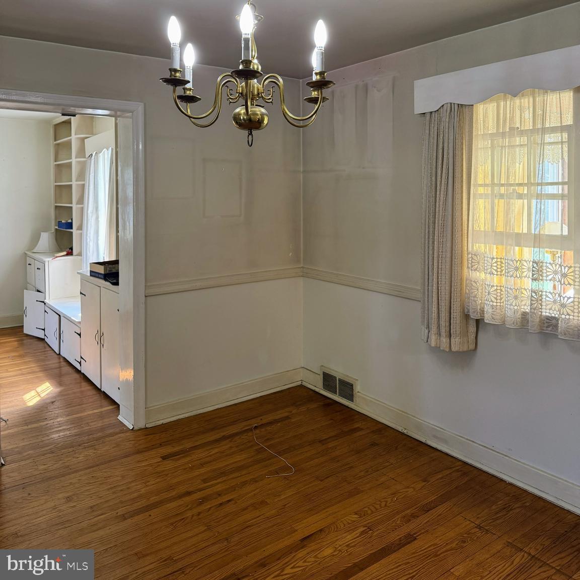 407 Willow Road Oreland, PA 19075 - Photo 8 of 30 a view of empty room with wooden floor and fan