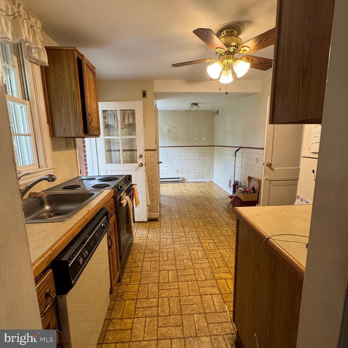 407 Willow Road Oreland, PA 19075 - Photo 9 of 30 a kitchen with a sink appliances and cabinets