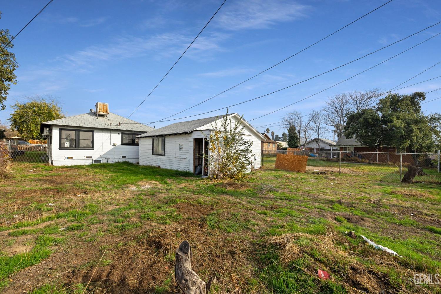 Undisclosed Address Bakersfield, CA 93308 - Photo 19 of 21 a front view of a house with garden