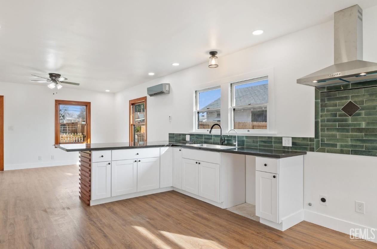 Undisclosed Address Bakersfield, CA 93308 - Photo 5 of 21 a bathroom with granite countertop a sink and a mirror