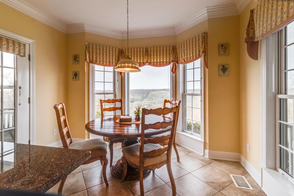 373 Gimlet Road Fayetteville, TN 37334 - Photo 13 of 29 a dining room with furniture window wooden floor and a chandelier