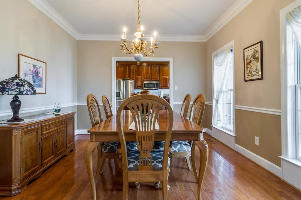 373 Gimlet Road Fayetteville, TN 37334 - Photo 6 of 29 a view of a dining room with furniture wooden floor and chandelier