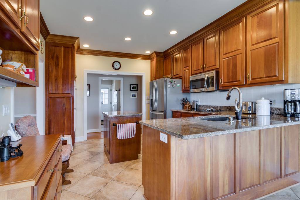 373 Gimlet Road Fayetteville, TN 37334 - Photo 9 of 29 a kitchen with stainless steel appliances granite countertop wooden cabinets a sink and a refrigerator