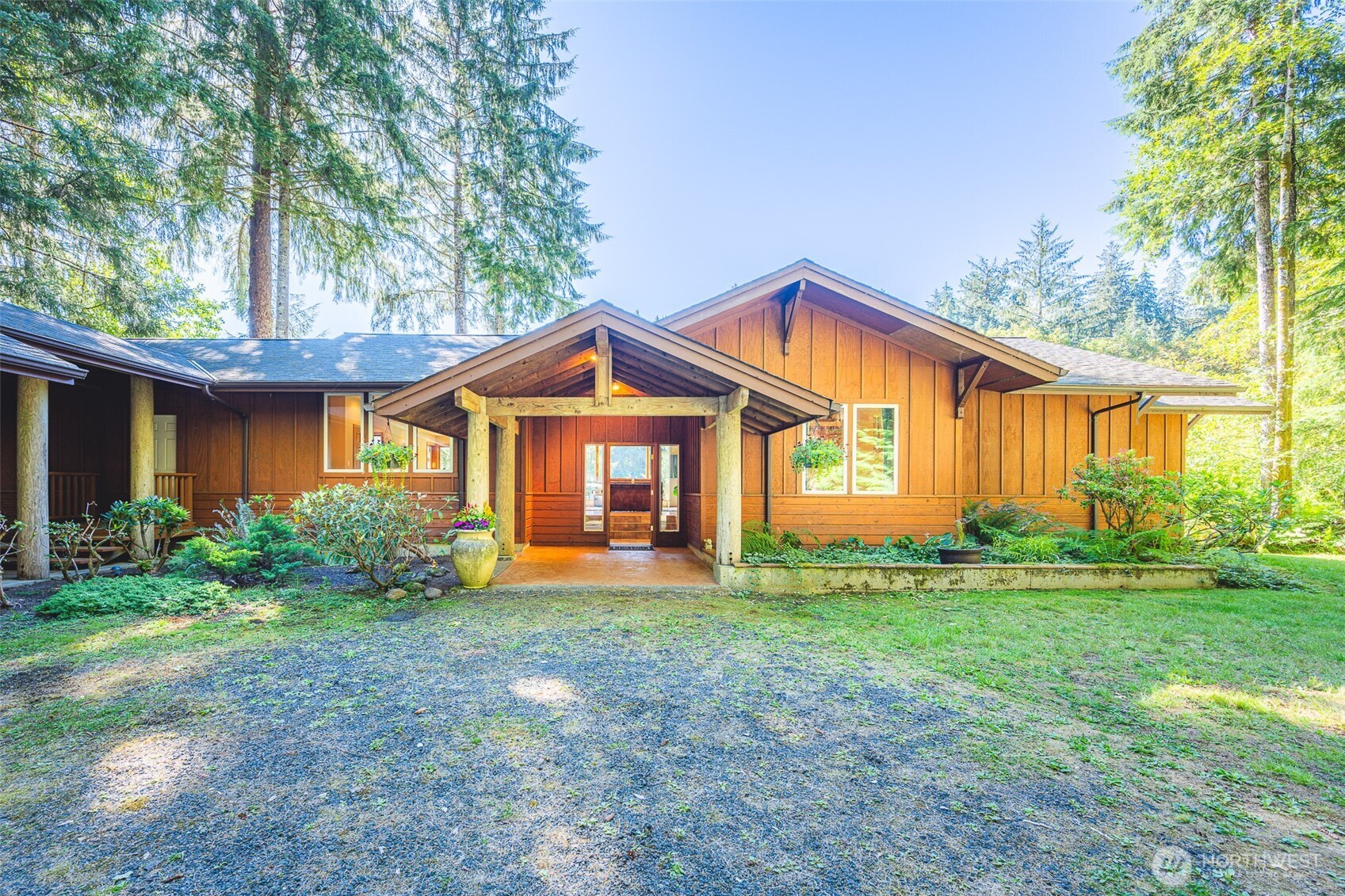 173 Pleasant Meadows Lane Beaver, WA 98305 - Photo 1 of 40 a front view of a house with garden