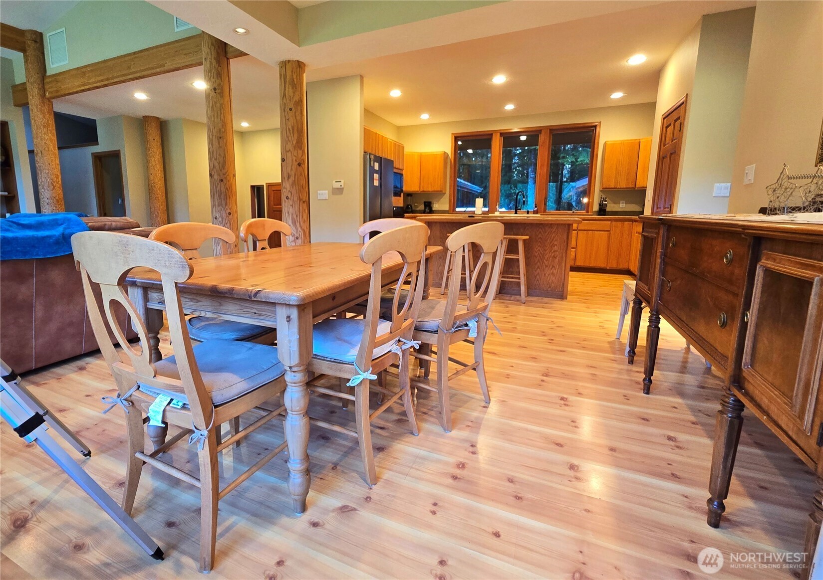 173 Pleasant Meadows Lane Beaver, WA 98305 - Photo 11 of 40 a view of a dining area with furniture and wooden floor