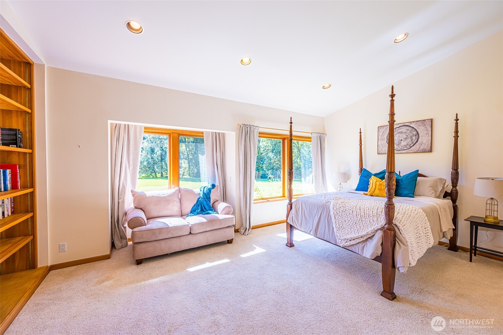 173 Pleasant Meadows Lane Beaver, WA 98305 - Photo 14 of 40 a spacious bedroom with a bed a couch and a window