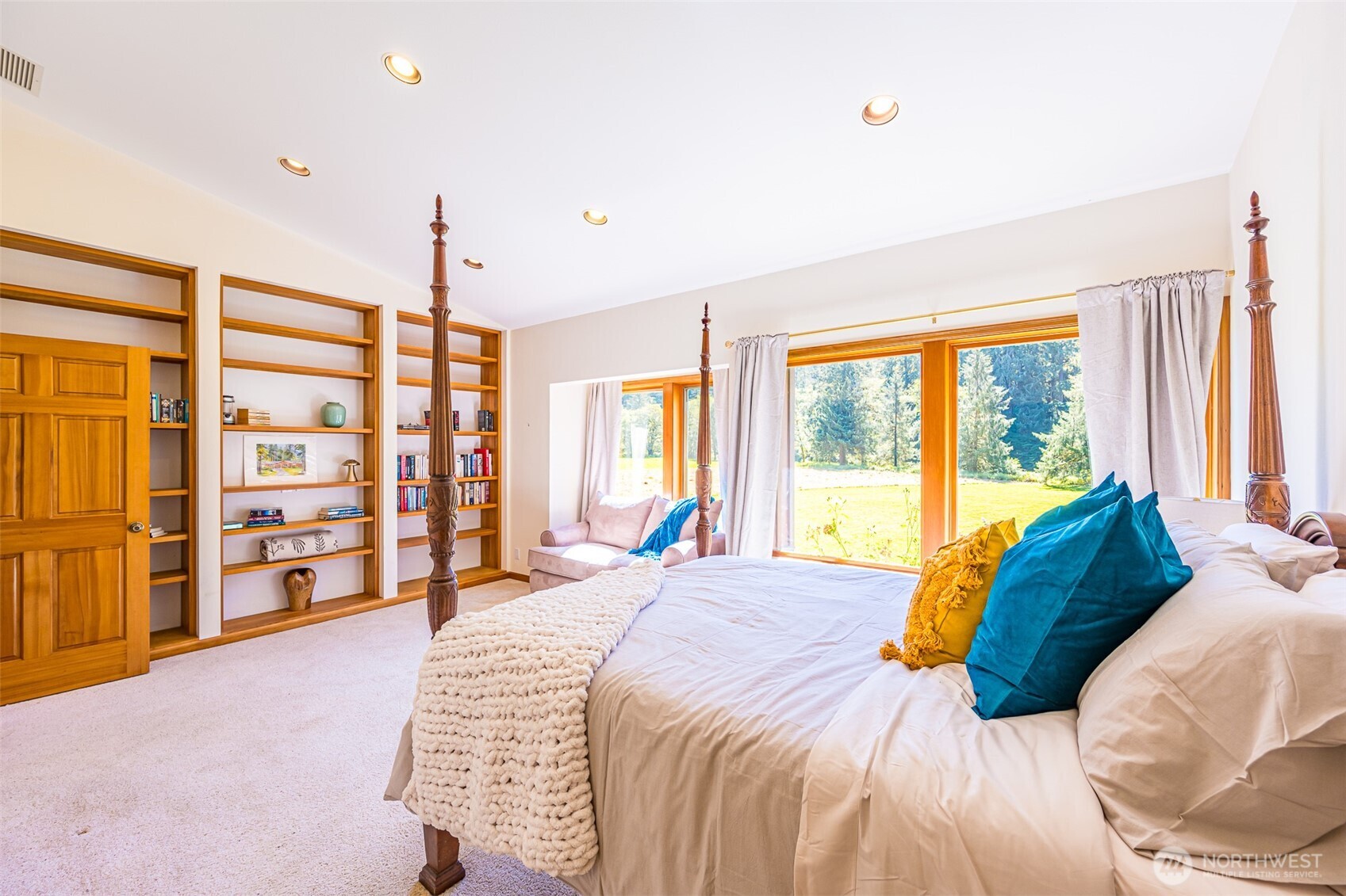 173 Pleasant Meadows Lane Beaver, WA 98305 - Photo 15 of 40 a bedroom with a large bed and a large window