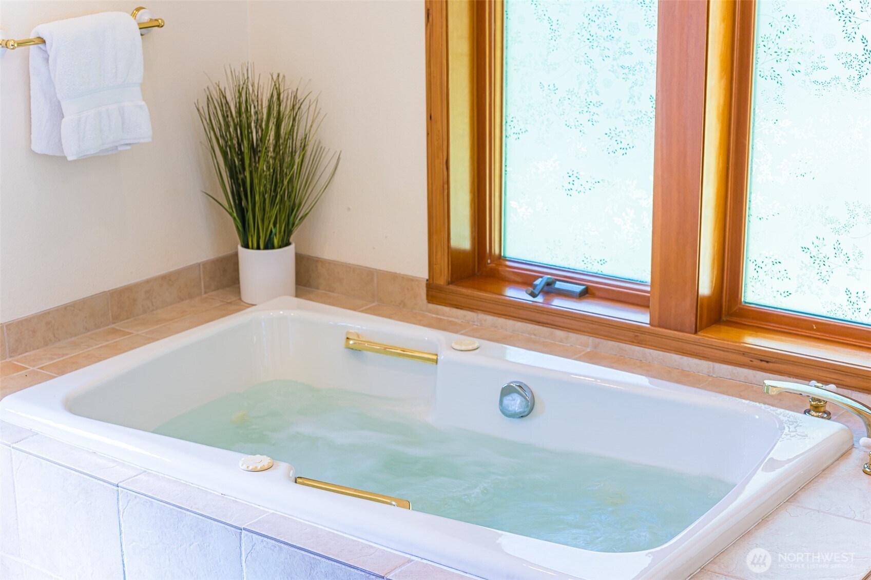 173 Pleasant Meadows Lane Beaver, WA 98305 - Photo 18 of 40 a bath tub sitting in a bathroom next to a window