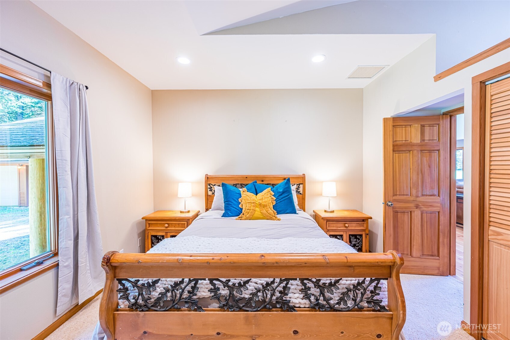 173 Pleasant Meadows Lane Beaver, WA 98305 - Photo 21 of 40 a bedroom with a bed and wooden floor