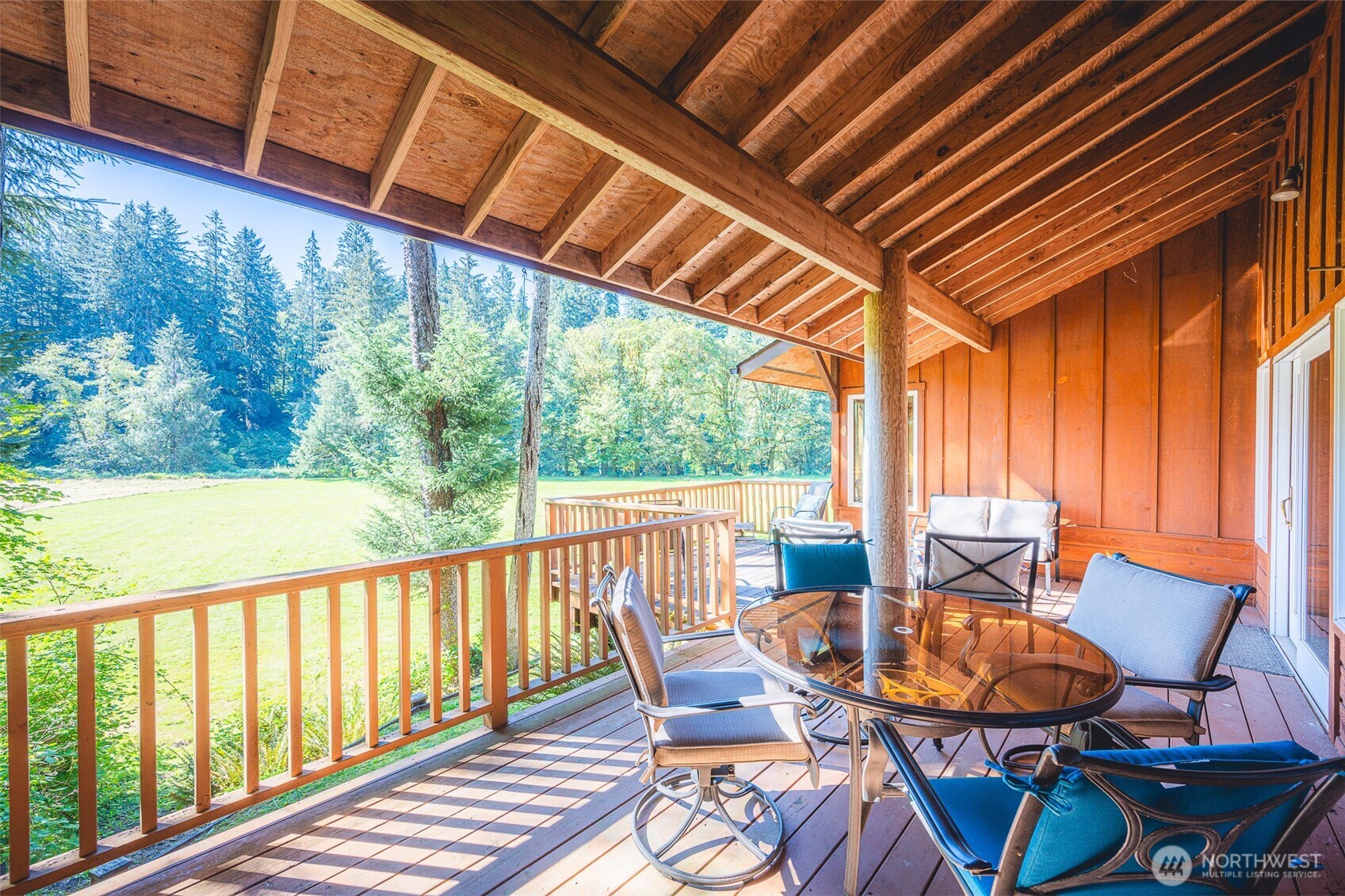 173 Pleasant Meadows Lane Beaver, WA 98305 - Photo 29 of 40 a balcony with table and chairs