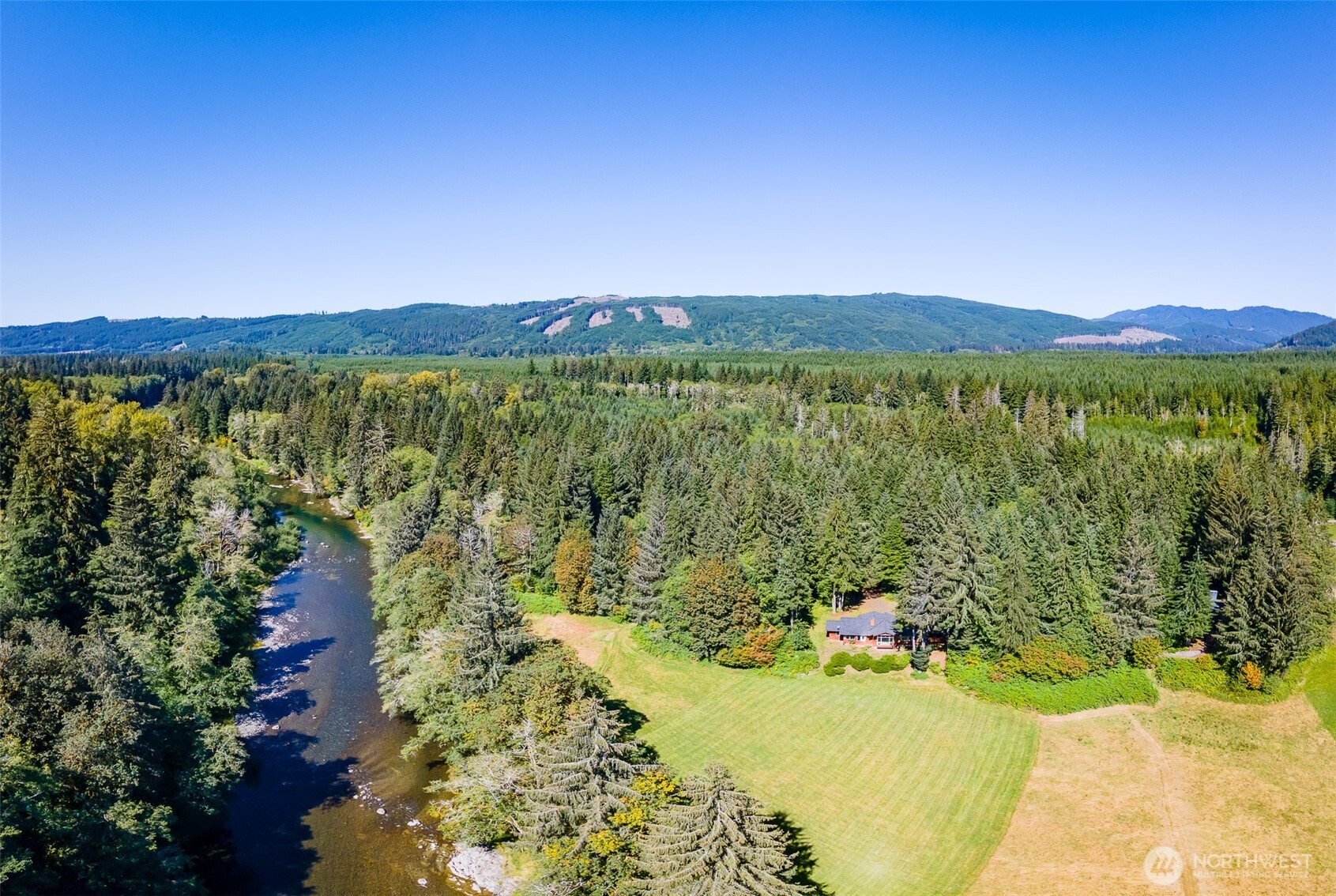 173 Pleasant Meadows Lane Beaver, WA 98305 - Photo 35 of 40 a view of a lake with a mountain in the background