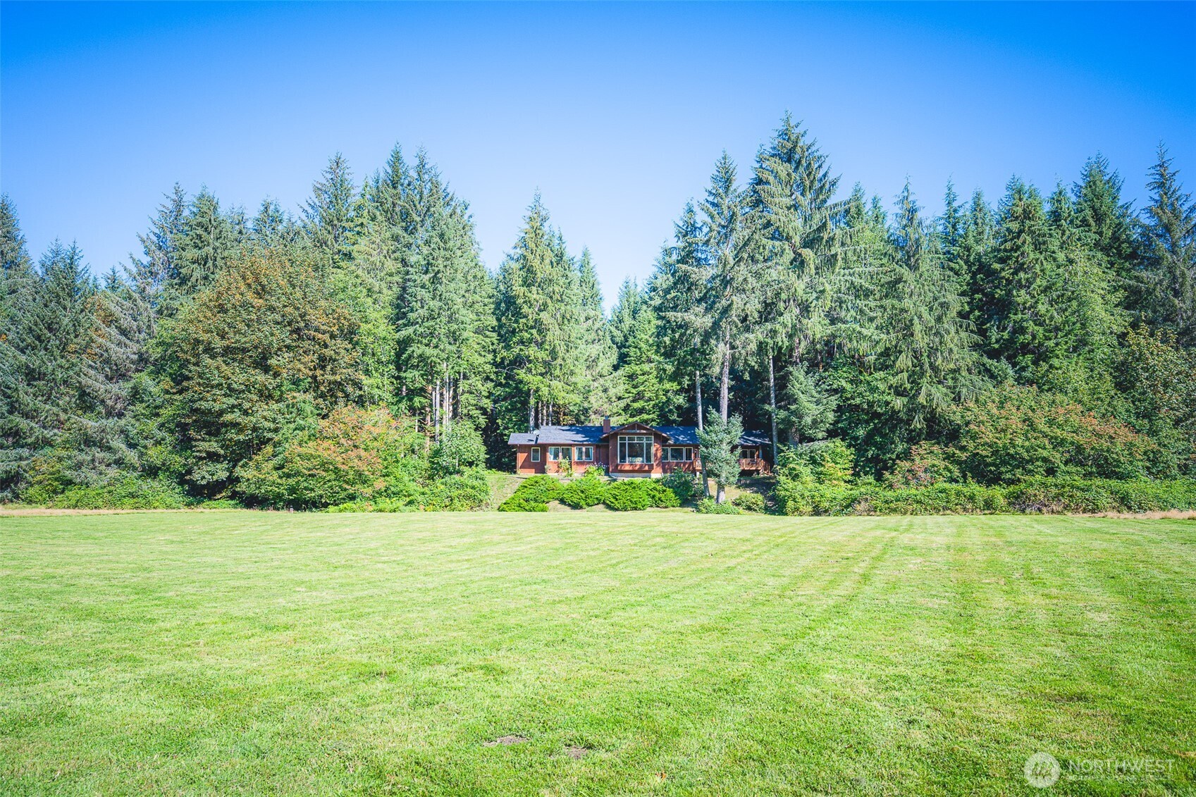 173 Pleasant Meadows Lane Beaver, WA 98305 - Photo 37 of 40 a view of a garden with a house in the background