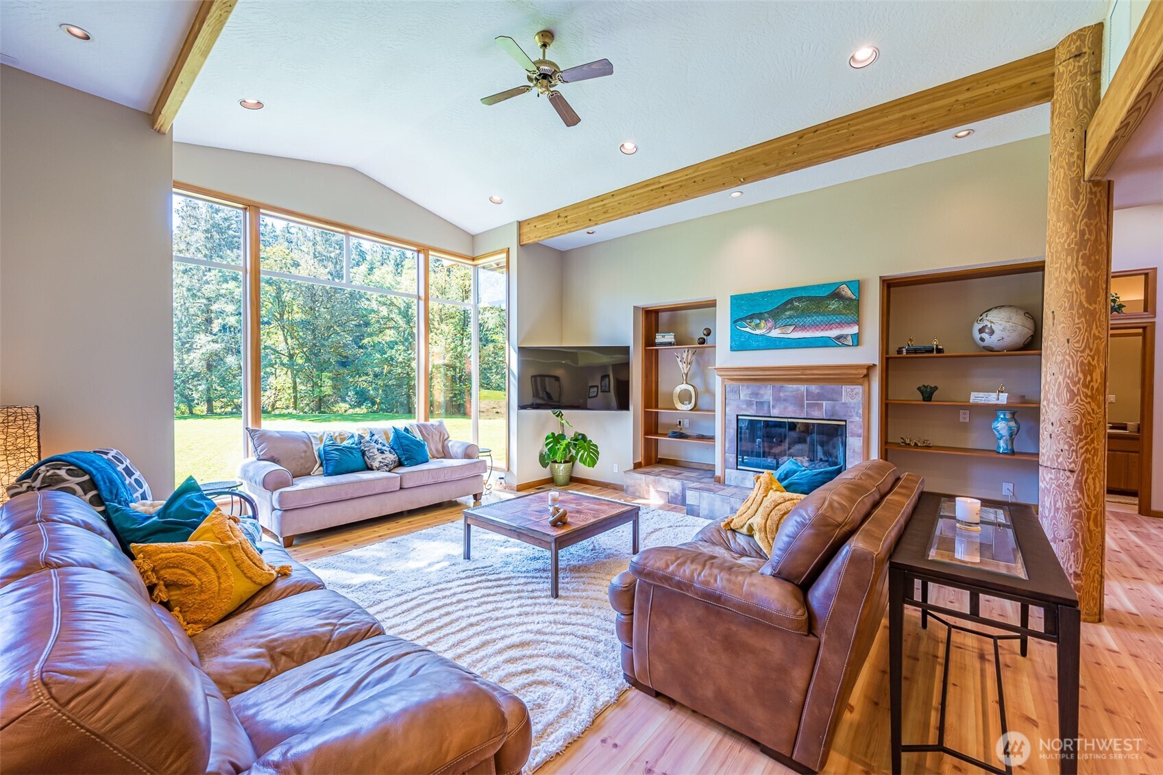 173 Pleasant Meadows Lane Beaver, WA 98305 - Photo 6 of 40 a living room with fireplace furniture and a large window