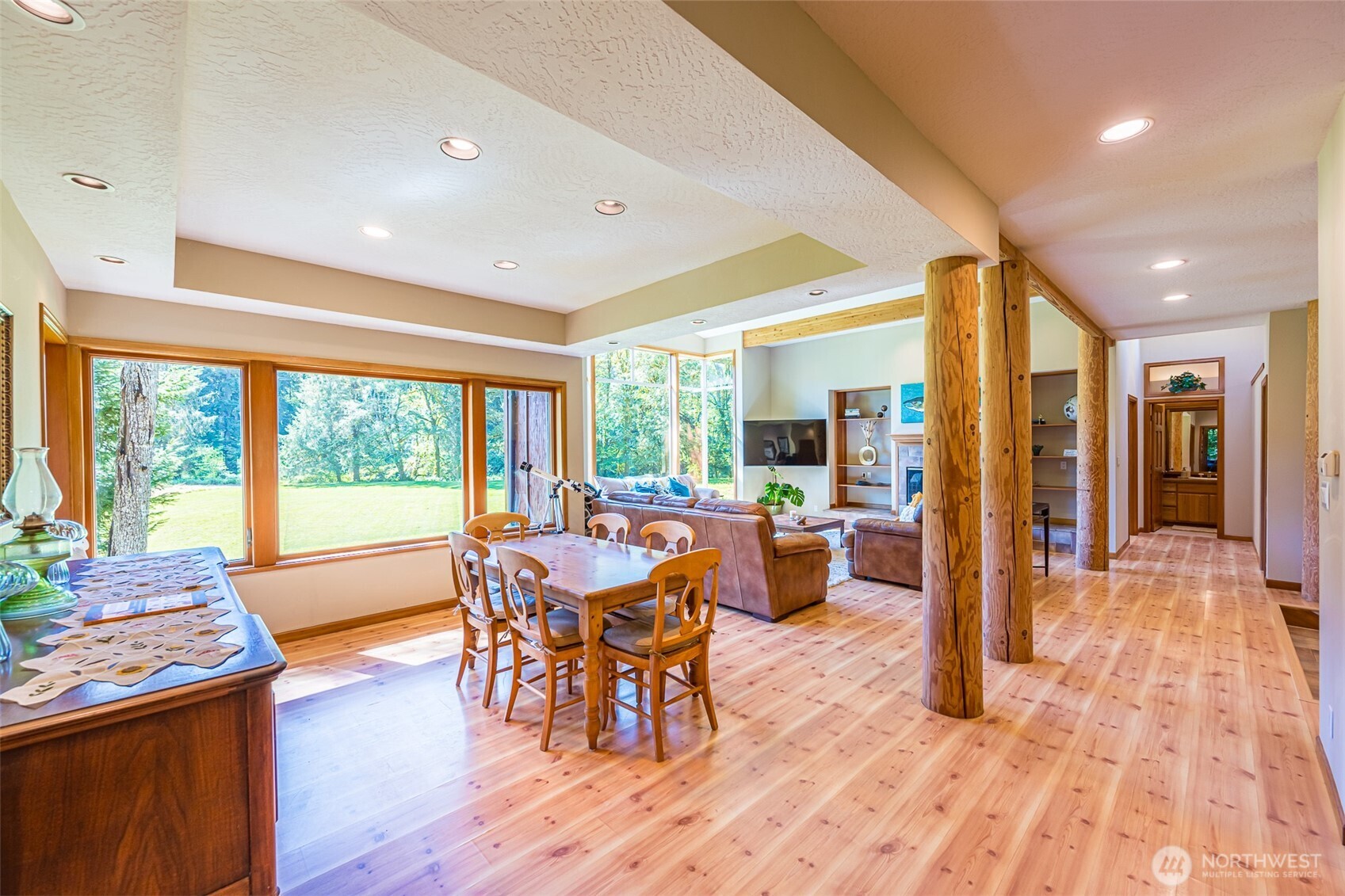 173 Pleasant Meadows Lane Beaver, WA 98305 - Photo 10 of 40 a view of a dining room with furniture window and wooden floor