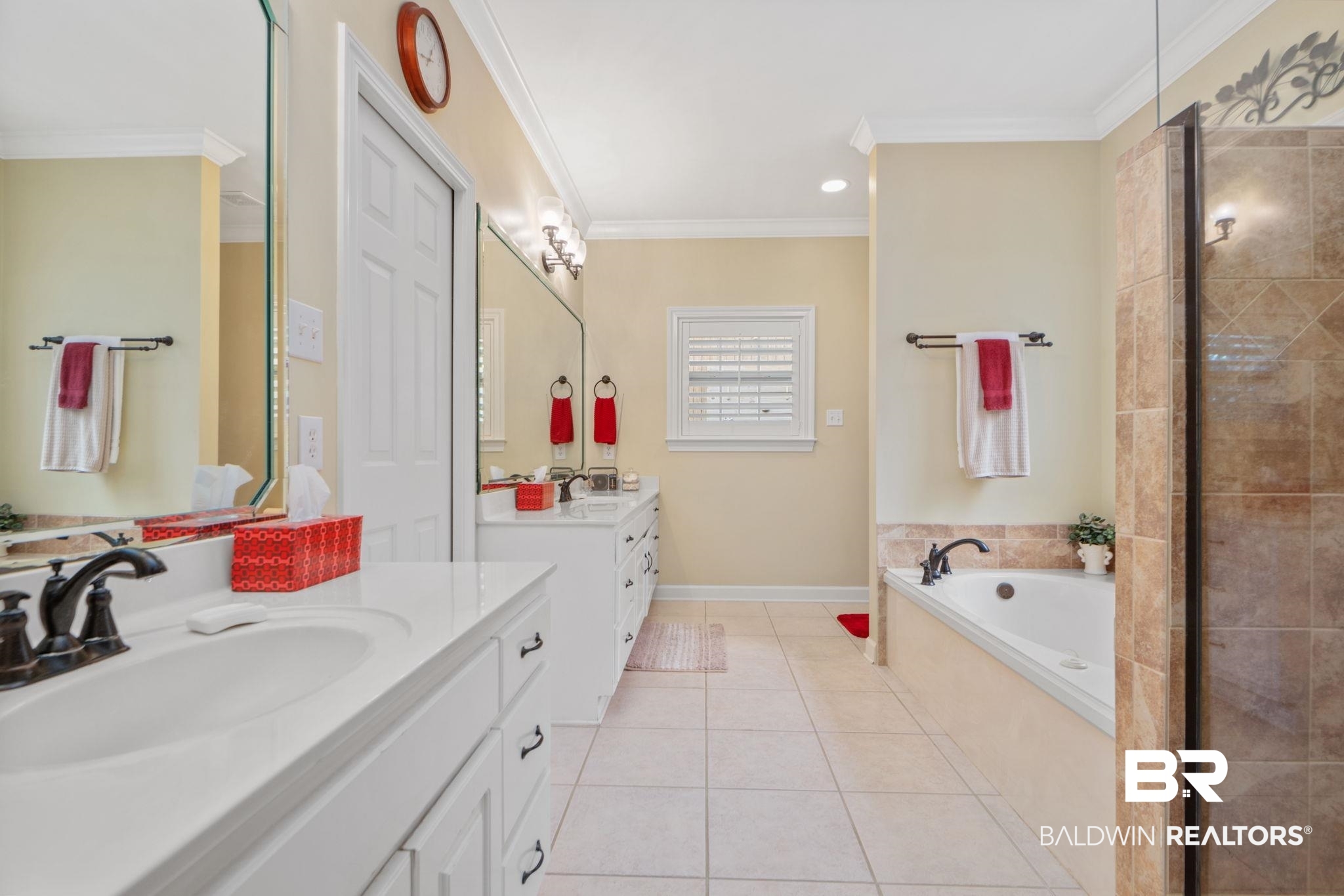 105 Beaver Dam Road Fairhope, AL 36532 - Photo 22 of 55 Bathroom featuring tile patterned flooring, ornamental molding, tiled bath, and vanity