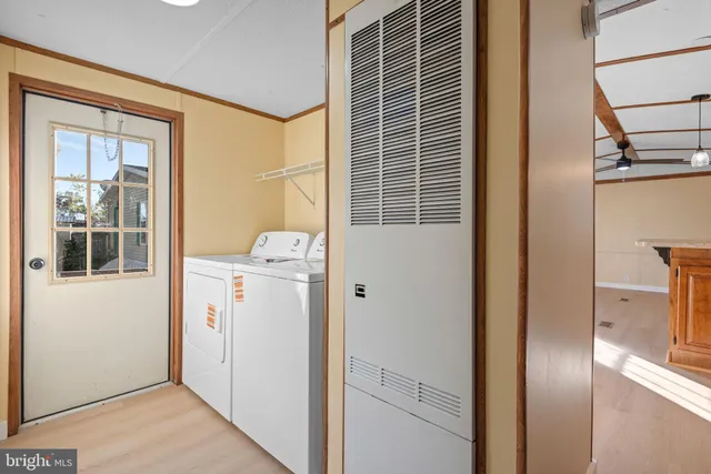 a view of hallway with washer and dryer
