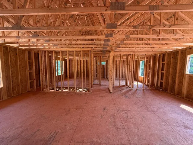 a view of an empty room with wooden walls