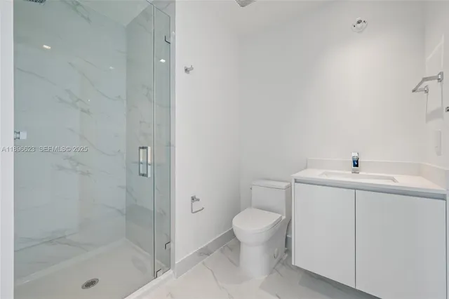 a view of living room with furniture and potted plants