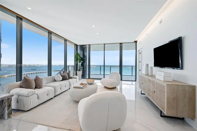 a bedroom with a large bed and a couch