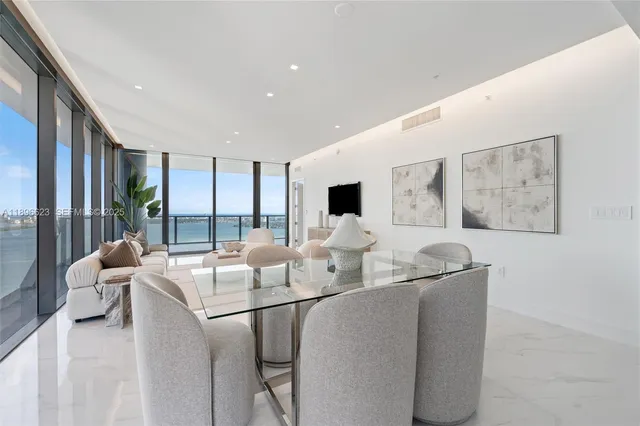 a living room with furniture a potted plant and a potted plant