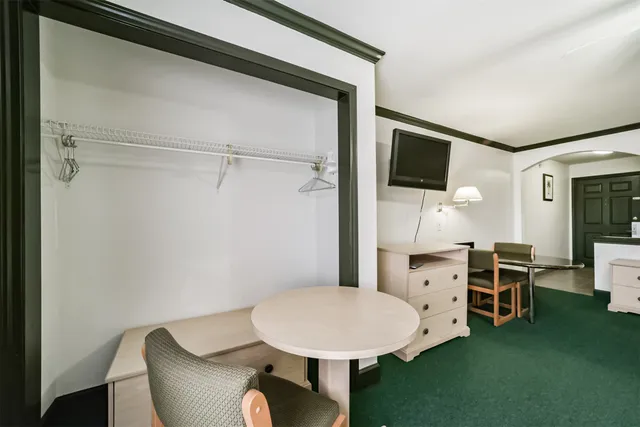 a view of a livingroom with furniture and a flat screen tv