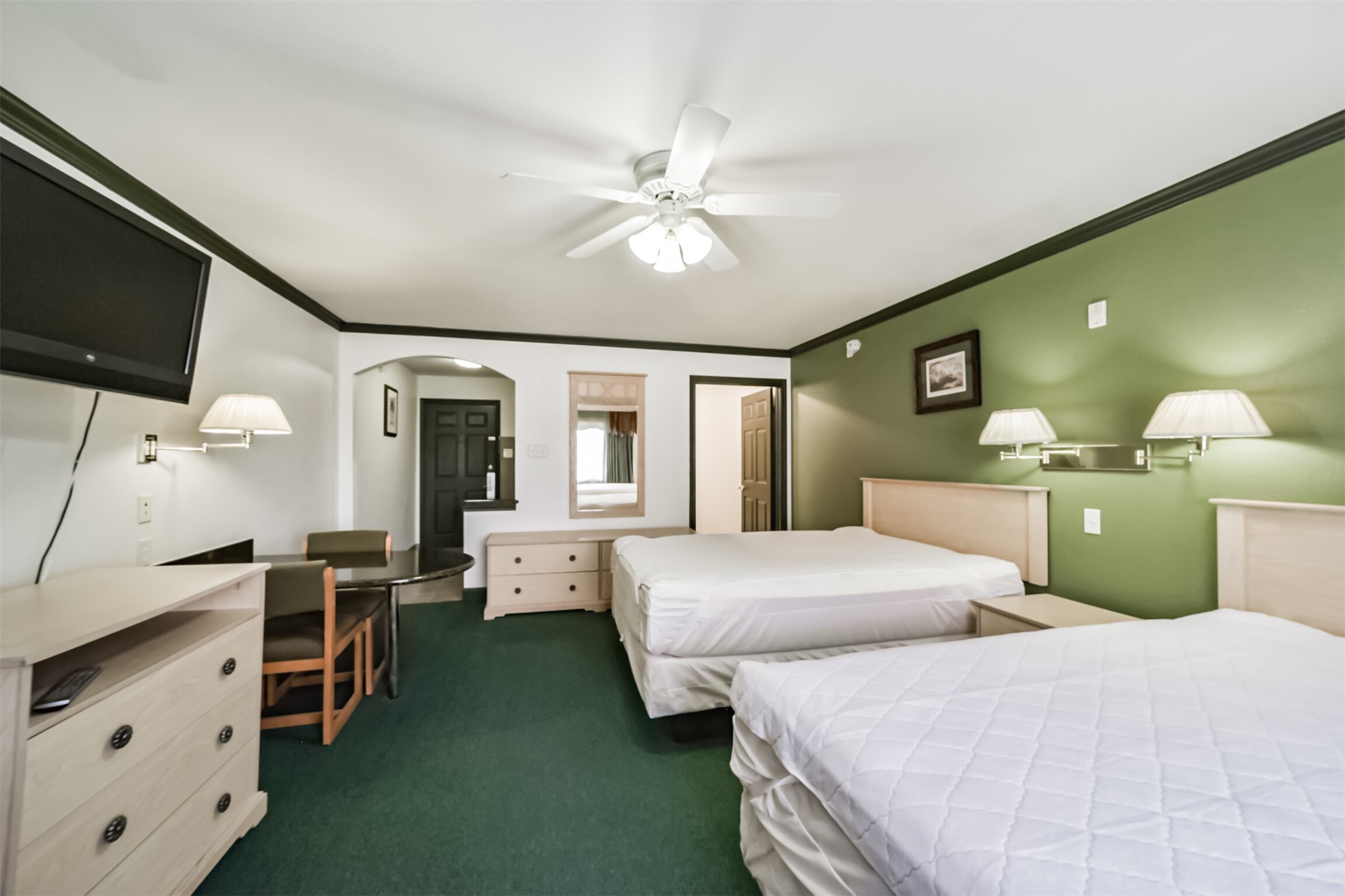 1025 Swanson Street, Unit 309 Houston, TX 77030 - Photo 13 of 21 a bedroom with double bed and a flat tv screen on dresser