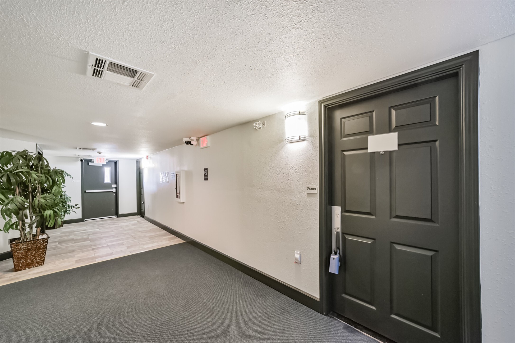 1025 Swanson Street, Unit 309 Houston, TX 77030 - Photo 3 of 21 wooden floor in an empty room