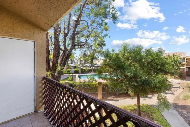 a view of balcony with wooden floor