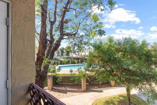 a view of backyard with plants and outdoor seating