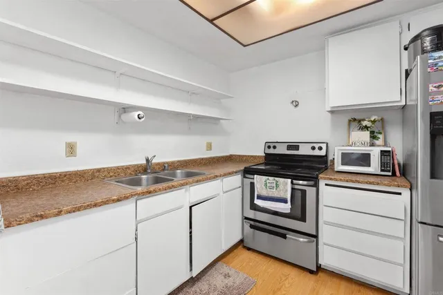 a kitchen with a stove and a sink