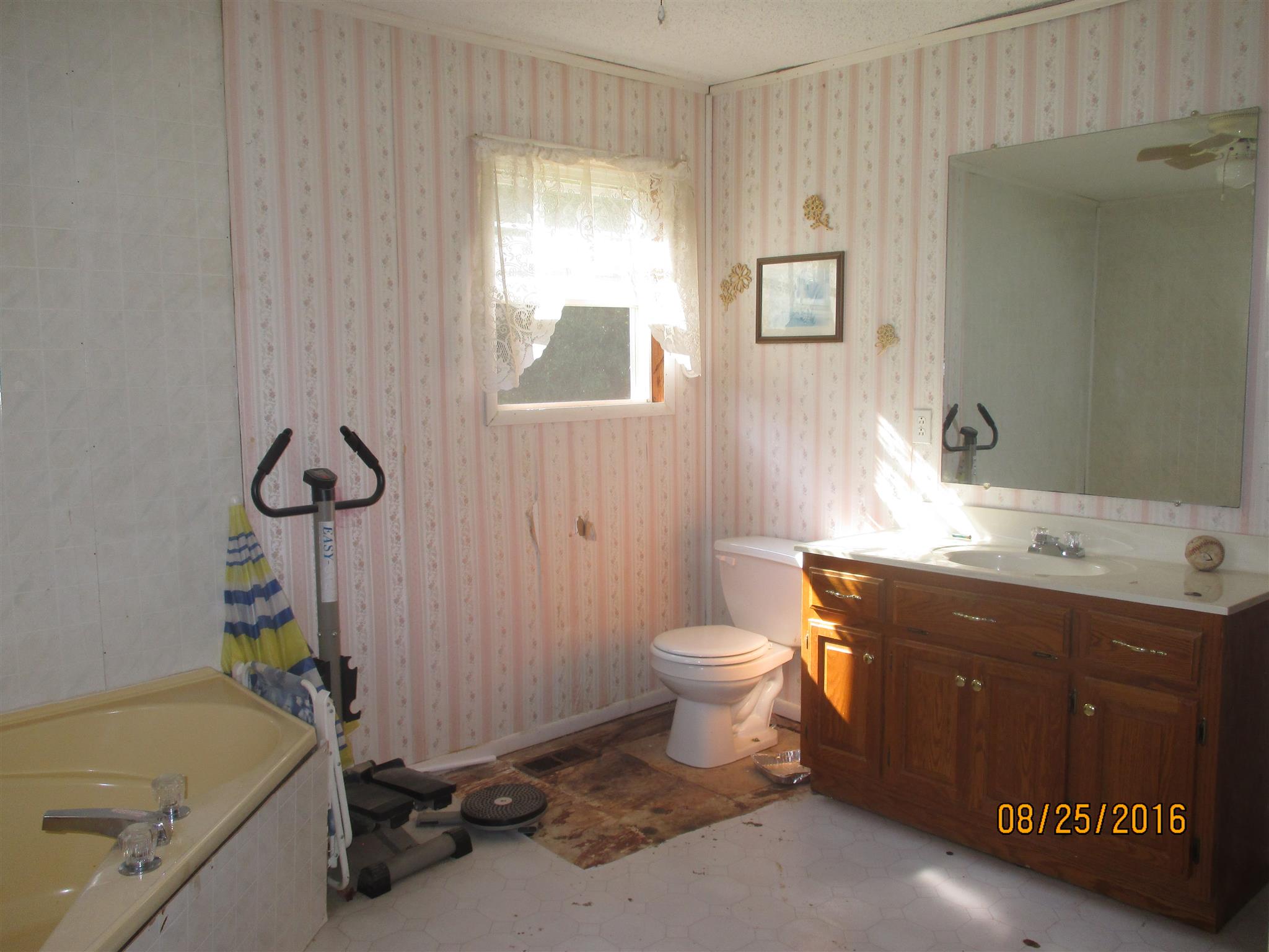 1150 Dog Branch Road Prospect, TN 38477 - Photo 13 of 28 a bathroom with a sink a toilet and shower