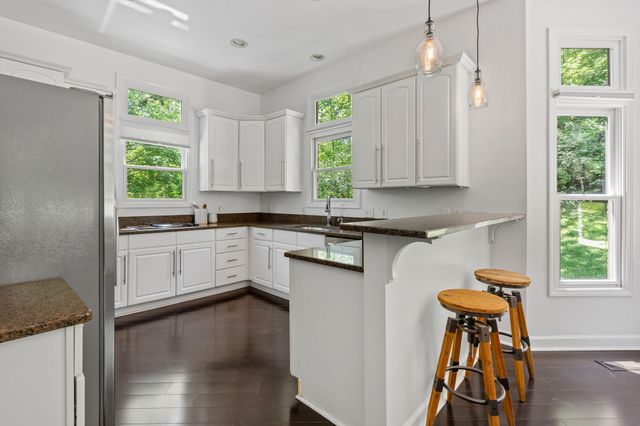 a kitchen with a window a sink and a window