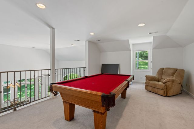 a living room with furniture and windows