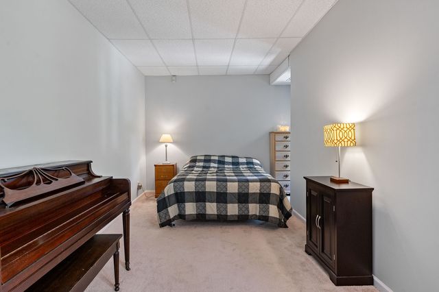 a bedroom with bed and window