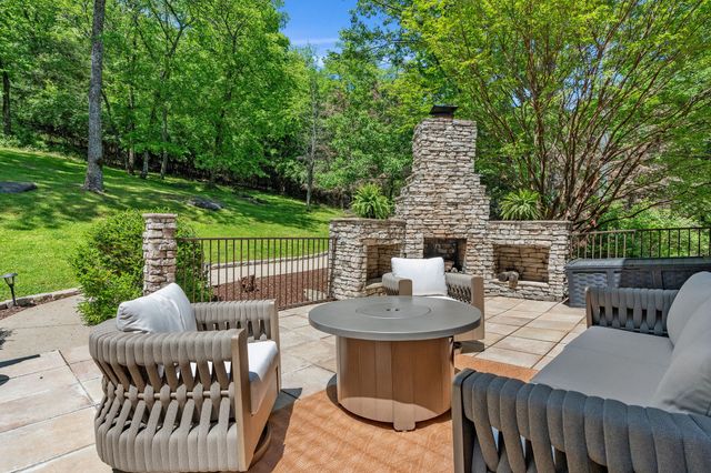 a view of a patio with a table and chairs