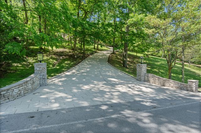 a view of a street with a yard