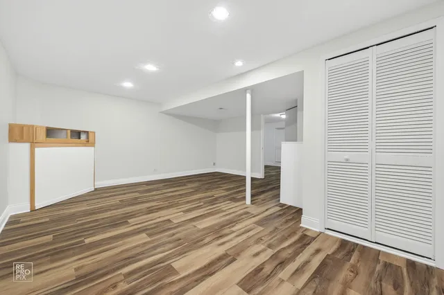 a view of a big room with wooden floor and closet