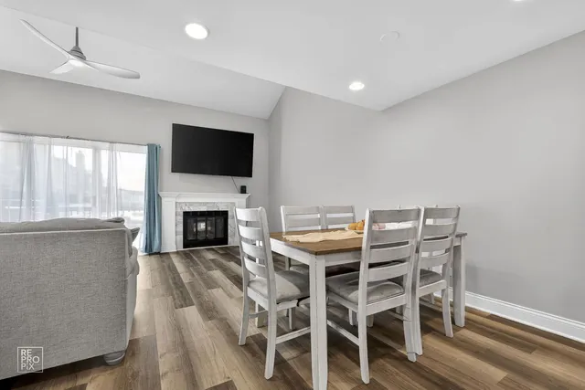a view of a livingroom with furniture and a fireplace
