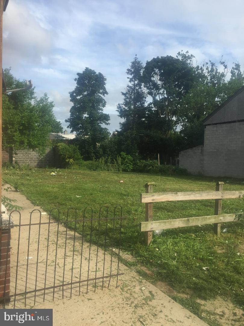 4669 Hawthorne Street Philadelphia, PA 19124 - Photo 3 of 5 a view of a swimming pool with a yard