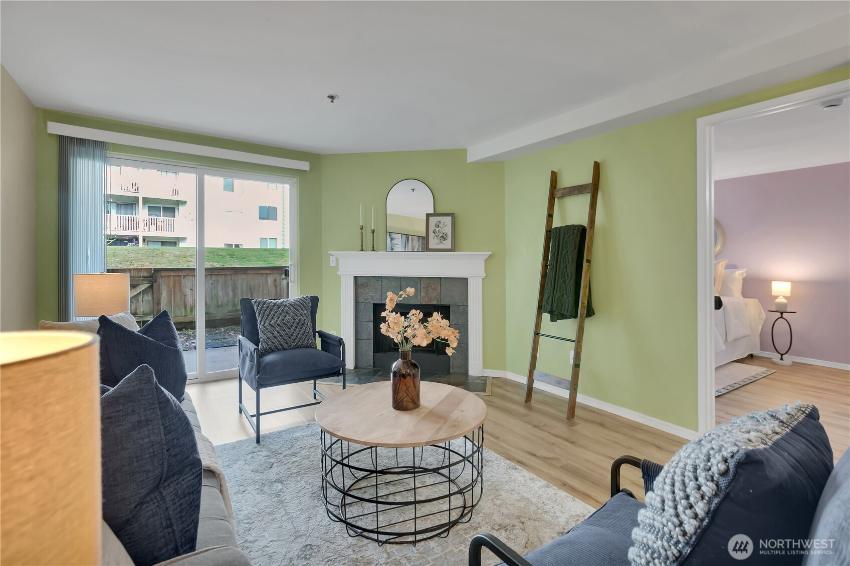 a living room with furniture and a fireplace