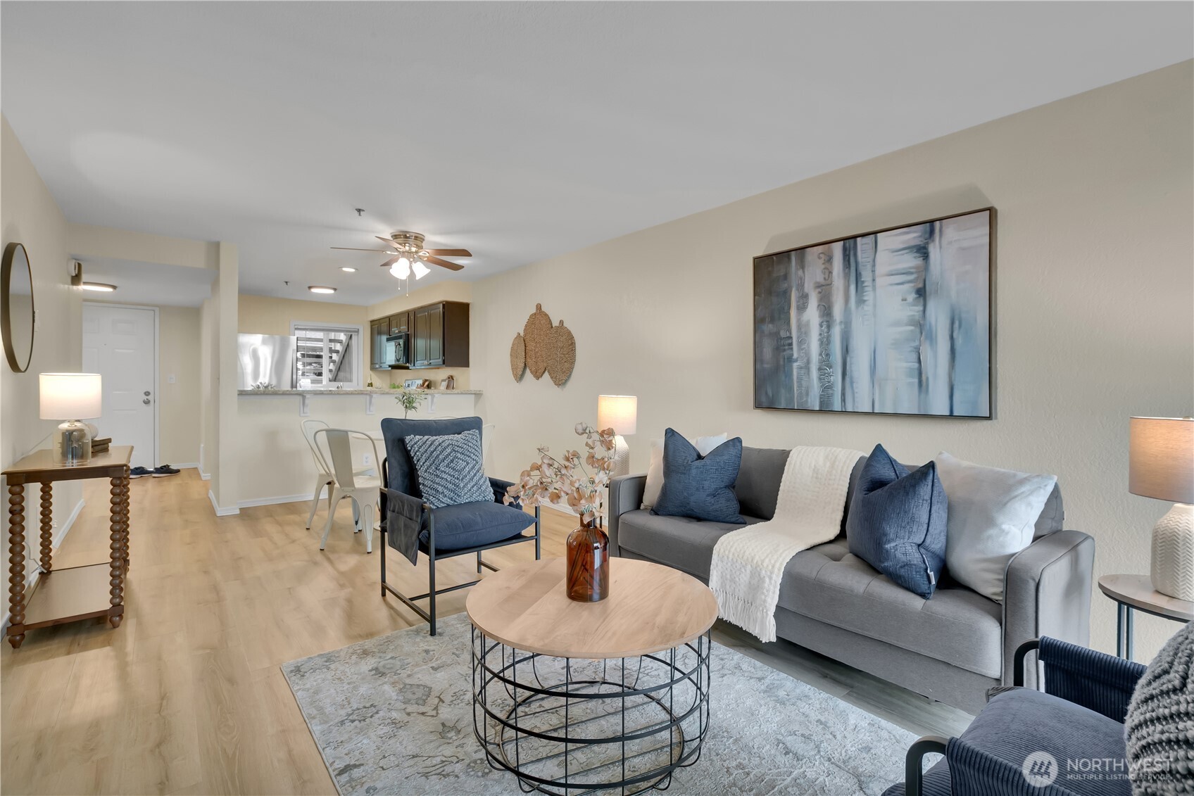 25035 98th Place South, Unit D102 Kent, WA 98030 - Photo 11 of 28 a living room with furniture kitchen view and a table